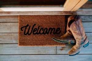 Welcome mat and cowboy boots