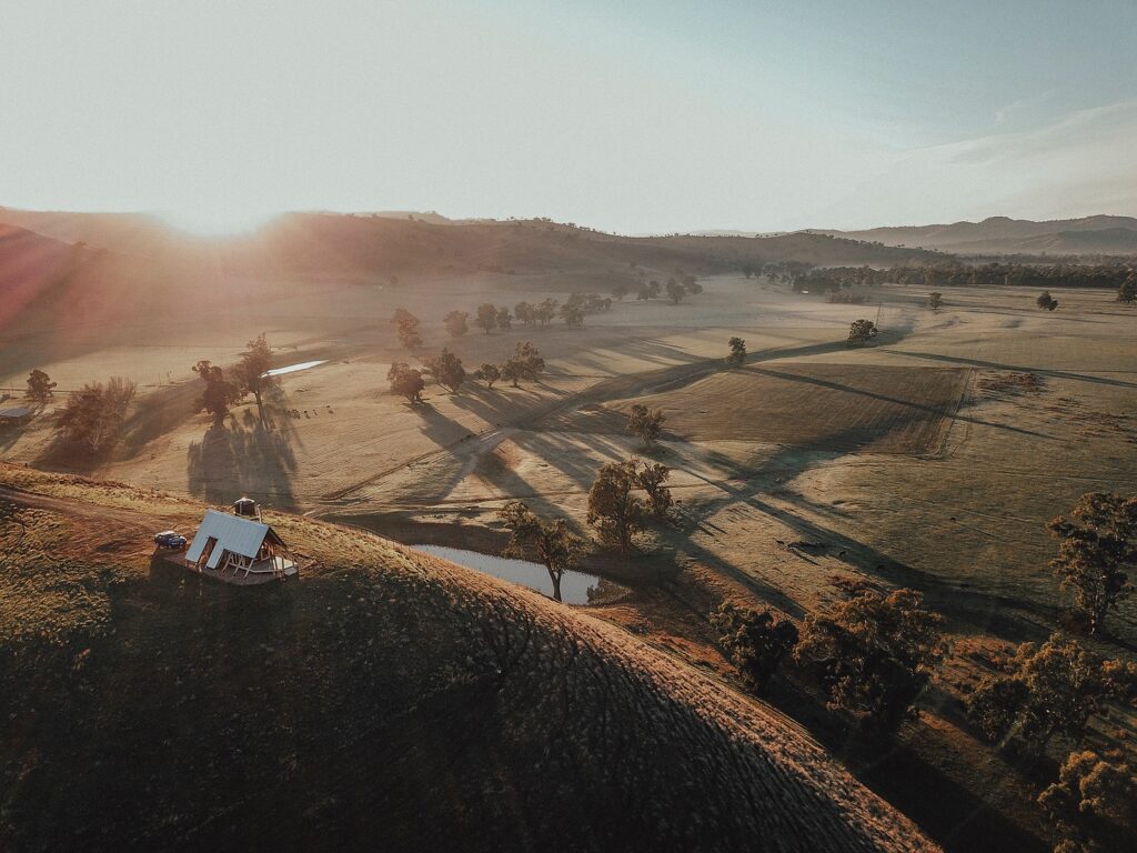 small A-frame hut off the grid sits high on a hill surrounded by beautiful natural countryside