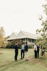 Wedding guests at a ceremony at the historic house of Kimo Estate in Gundagai. A real farm wedding.