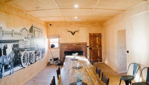 historic mural on the wall of the shearers quarters at Kimo Estate, fireplace with wood fire and central heating