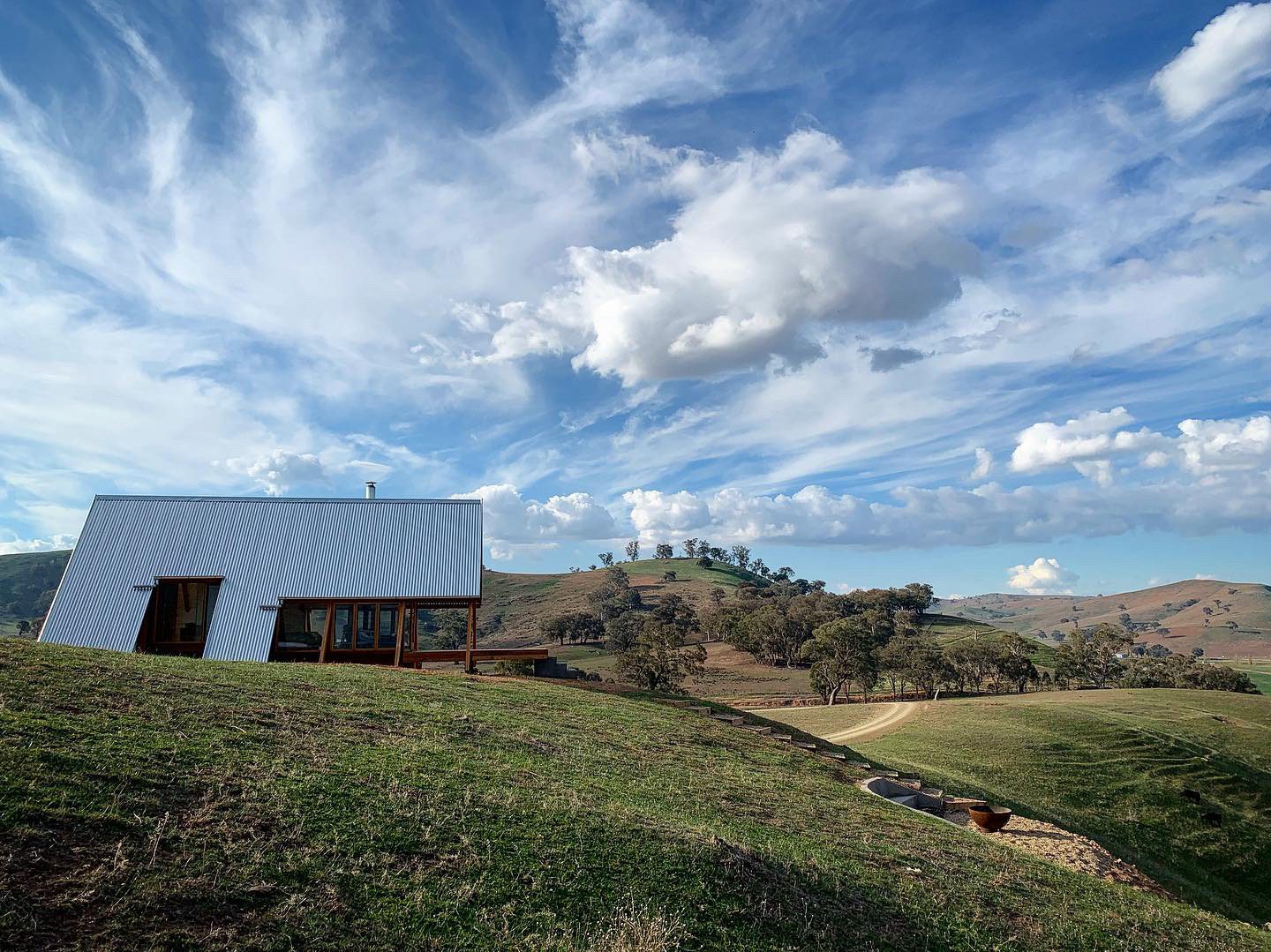 Hut on the side of a hill that is off grid