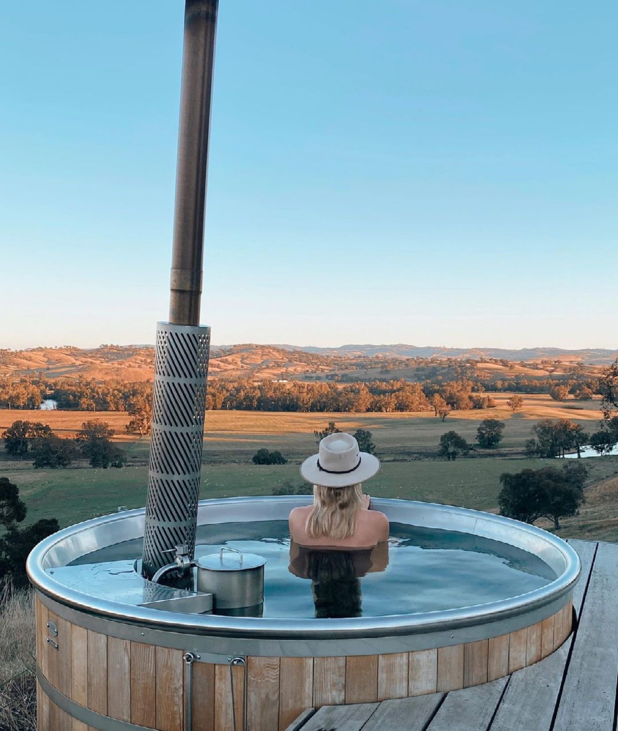 Soaking in the hot tub at the Kimo Estate huts. Best off grid accommodation in NSW