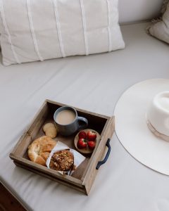 wooden box with scrumtious food and berries to enjoy while in hotel