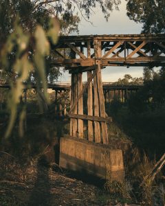 old timber rail bridge in the evening light
