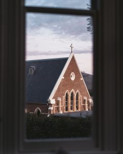 view through windows of flash jacks looking towards Catholic Church