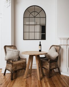 Dining area with two chairs and a bottle of local Gundagai wine by Nick Spencer