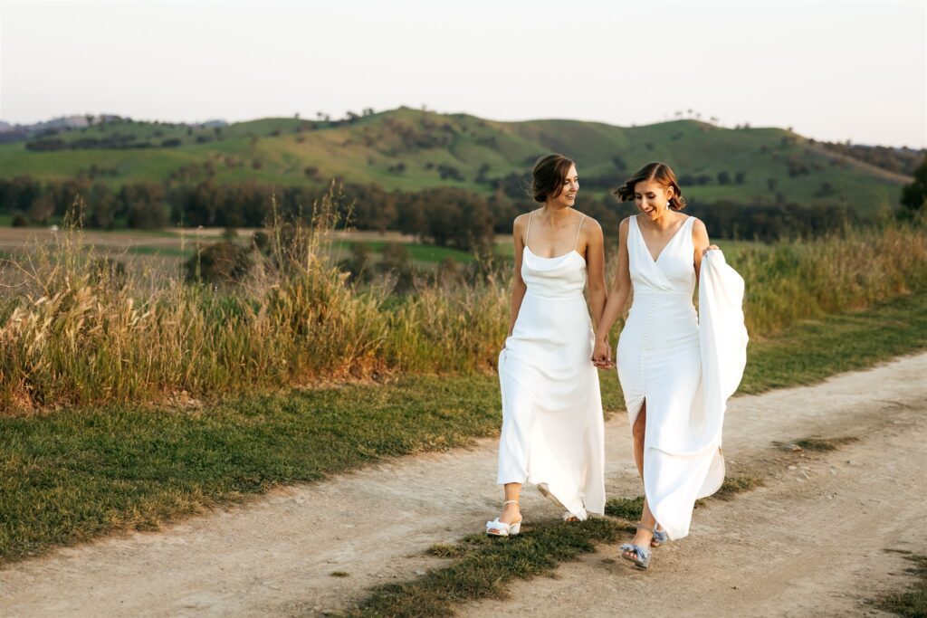 Bride and Bride walking along the track at the ecohuts