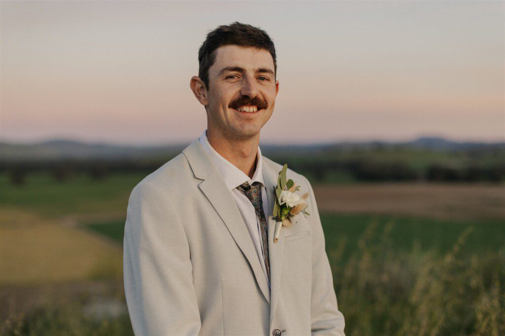A nice close up portrait of the groom beaming with happiness