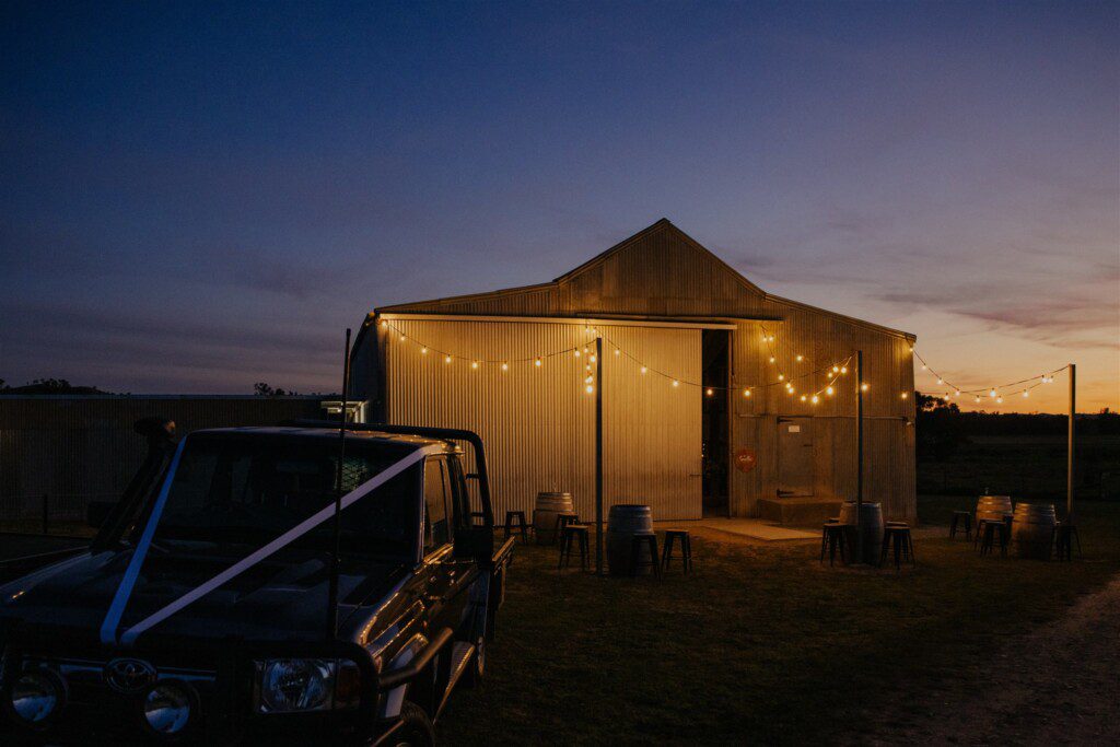 The Grain shed in the twilight serves as the wedding reception venue
