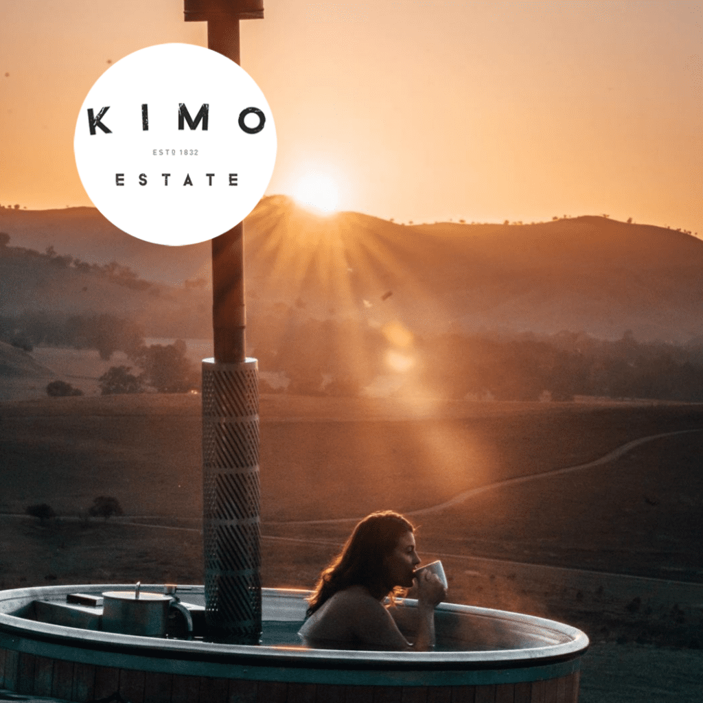 Wood Fired Hot tub → Kimo Estate Gundagai girl sips her coffee in the warm hot tub on a cold morning