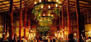 grand wedding venue with huge ceilings big enough for 200 guests. Barn like wedding venue with candles to create the atmosphere for brides and grooms and their guests.